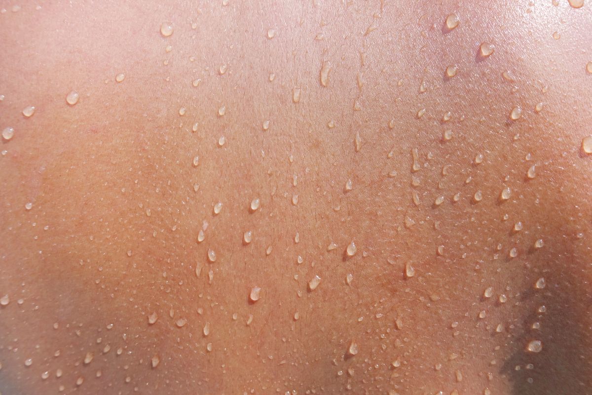Close up to beads of sweat on skin