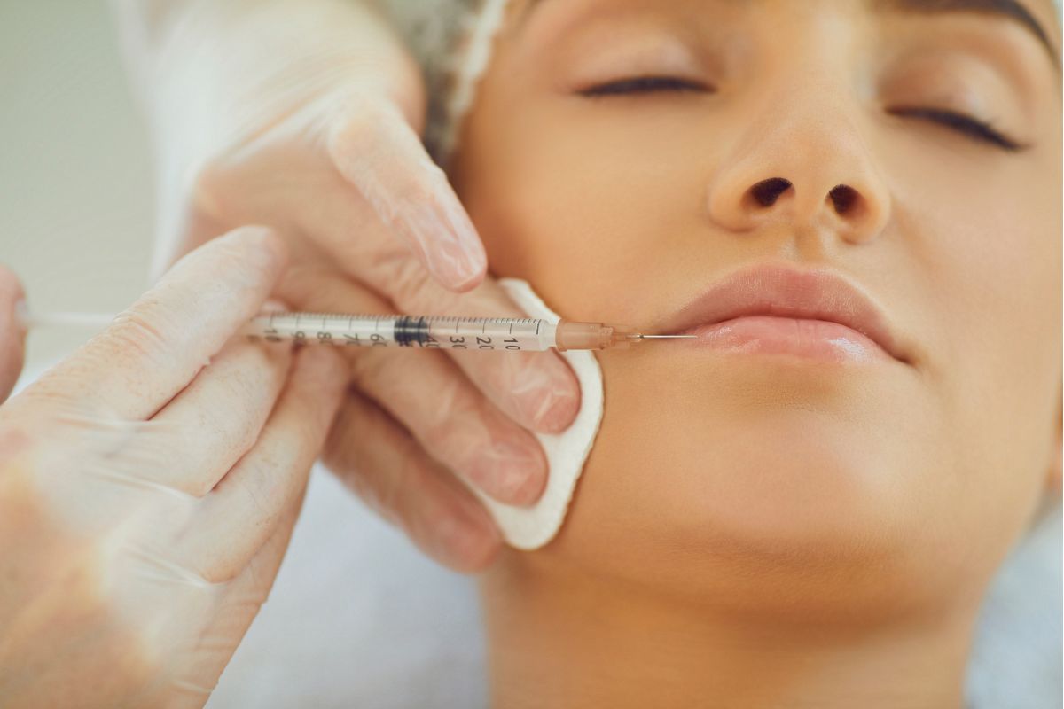 Woman receives dermal filler injectable treatment